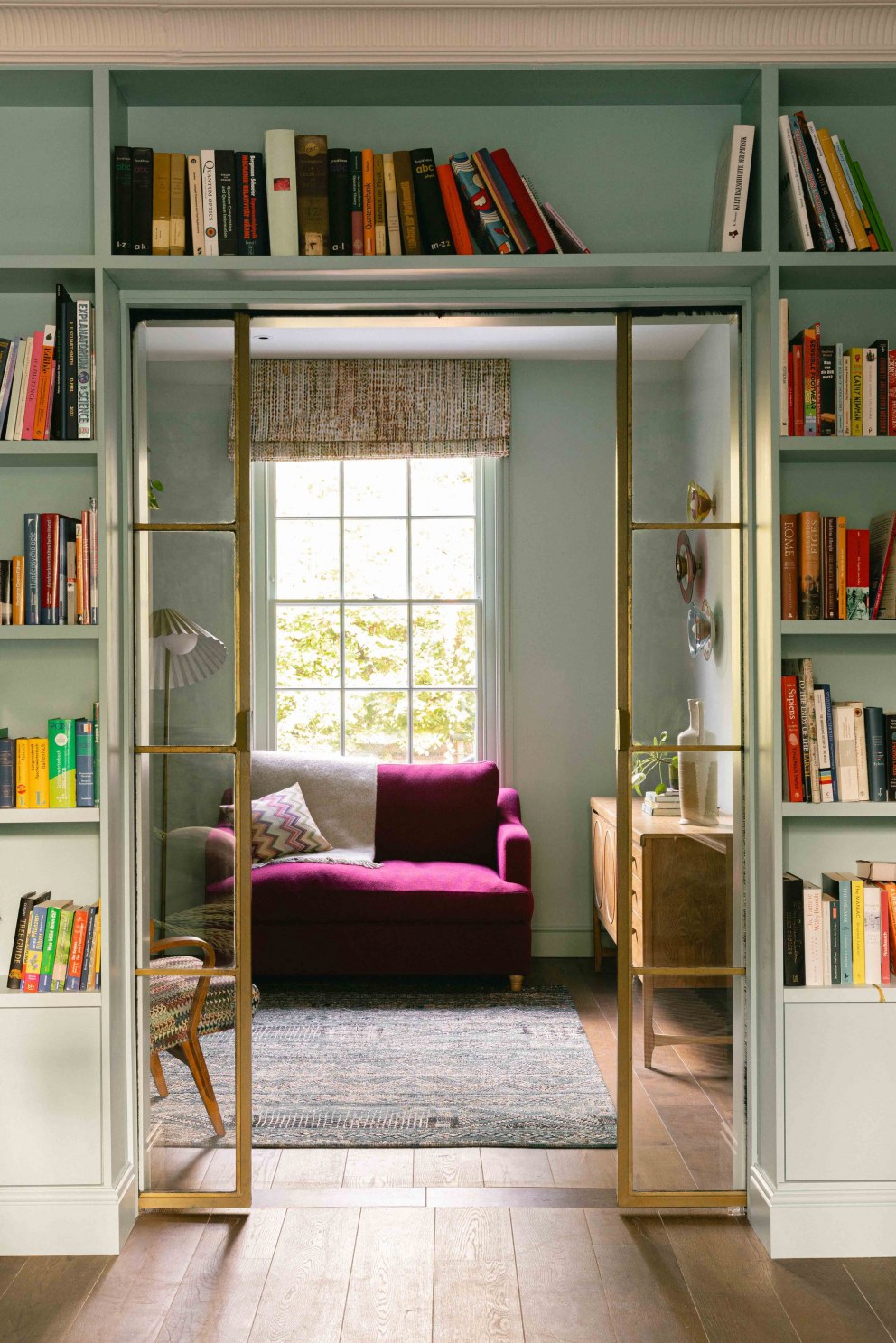 Victorian Terrace, Waterloo | Reclaimed brass doors open out into library space | Interior Designers